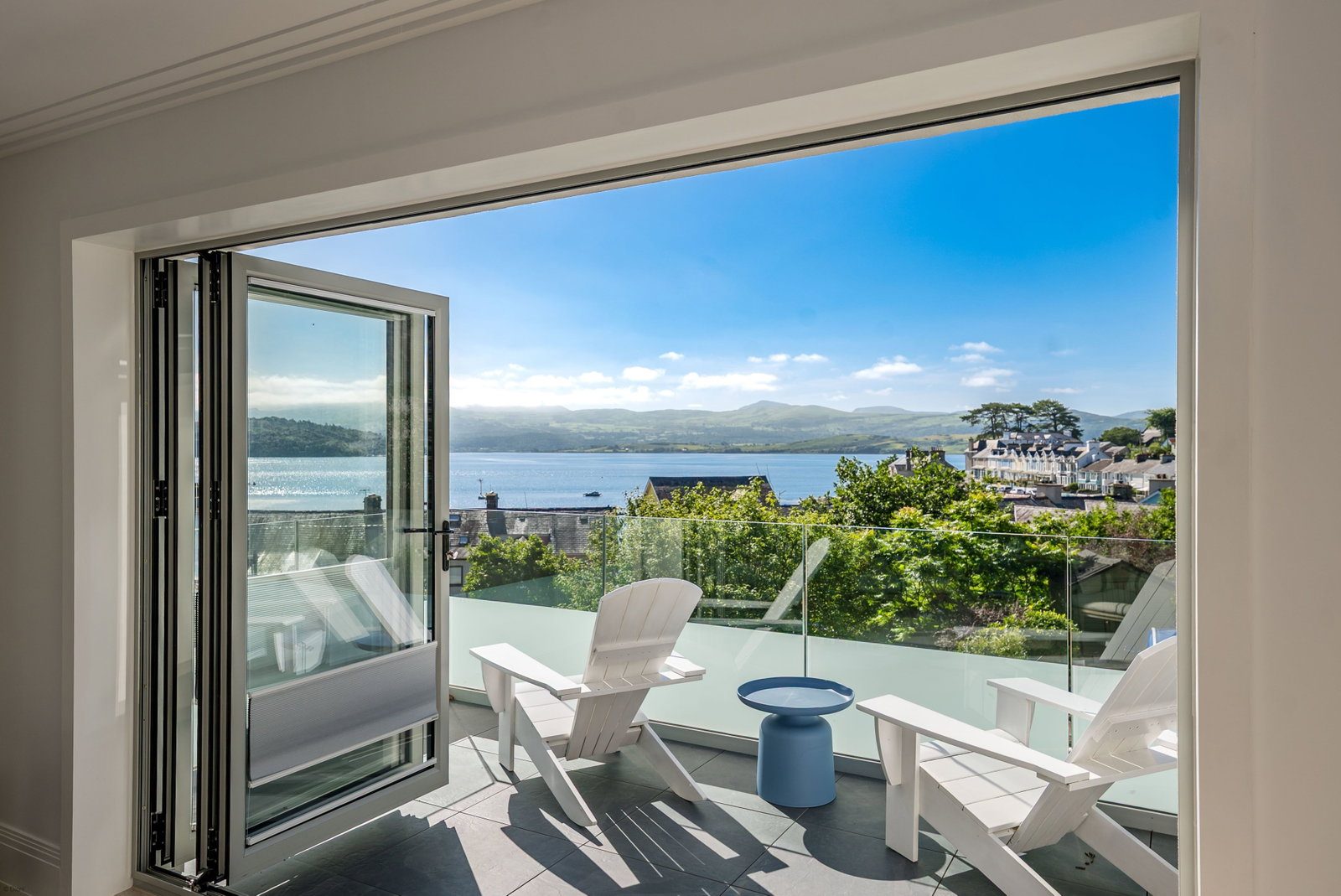 Sea view through open balcony doors